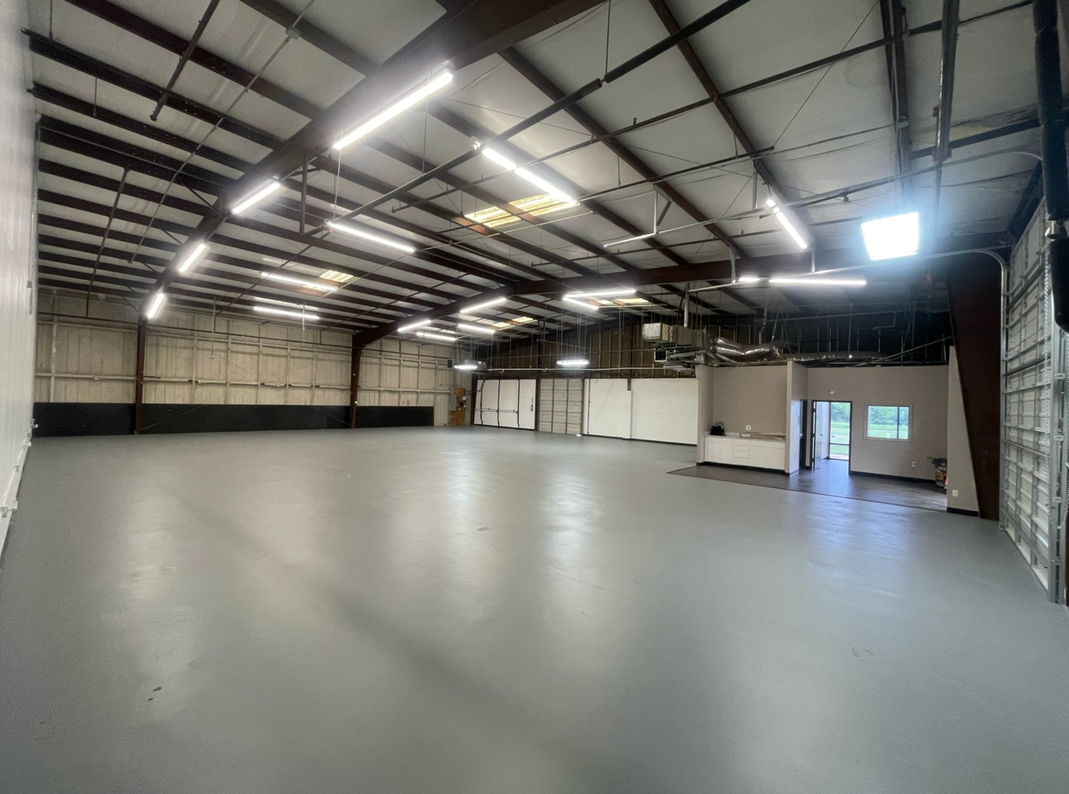 Interior of the 5,000 sq ft SigmaGrafix Mesquite vehicle wrap shop with room for 18-wheelers